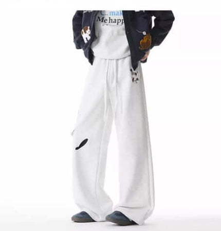 Embroidered Dog Sweatpants – Loose Fit showcased in a relaxed streetwear look with playful dog embroidery details.