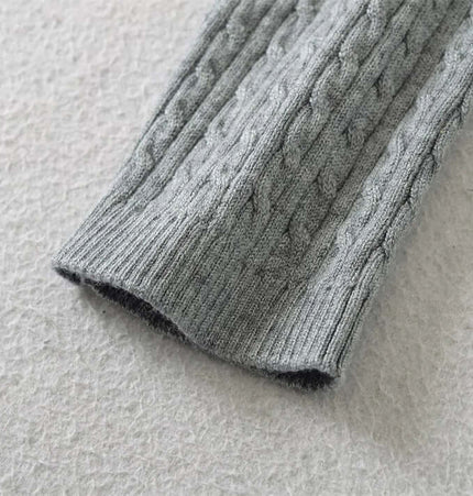 Round Neck Half-Button Knit Sweater close-up of the knit texture and sleeve detail