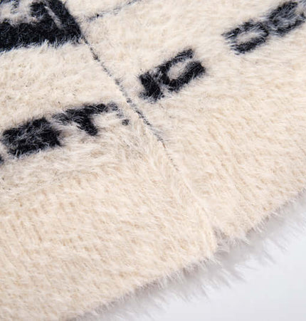 Close-up of the cozy texture and bold design of the Floral Jacquard Knit Cardigan – Loose Fit.