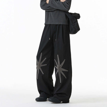 Black patterned technical trousers with Grozavu logo