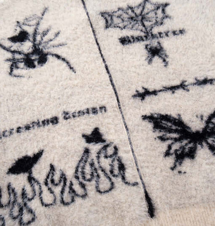 Casual Butterfly Spider Jacquard Cardigan featuring artistic butterfly and spider patterns on a cozy knit fabric.