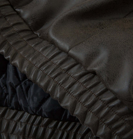 Detail of the Wool Collar PU Pilot Jacket – Loose Fit showing premium PU leather and soft polyester lining.