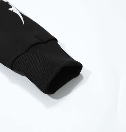 Close-up of the sleeve of the Vintage Gothic Zip-Up Hoodie – Slim Fit, showcasing its stylish design and cuff details.