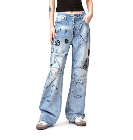 Distressed Denim Graffiti Print Trousers featuring bold graffiti prints and a washed distressed finish.