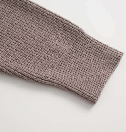 Close-up of the sleeve of the Lazy Streetwear Knit Sweater – Loose Fit showcasing textured knit design.