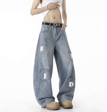 Knife-Cut Cargo Pants – Loose Fit featuring a unique wide-leg design and bold lettering on a distressed finish.