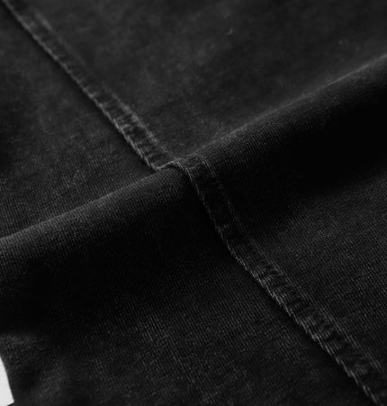 Close-up of the fabric detail of the Washed Spliced Distressed TShirt – Loose Fit showcasing its quality and texture.
