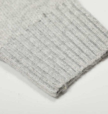 Close-up of the ribbed cuff of a Semi-High Neck Simple Knit Sweater in gray color, showcasing soft knit fabric.