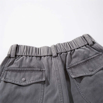 Patchwork Distressed Knife Pants showing elastic waistband and pockets, highlighting street style and comfort.