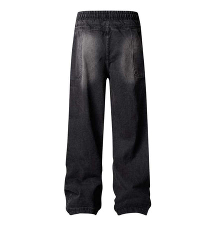 Back view of Distressed Pleated Reverse Denim Pants showcasing washed finish and relaxed fit.
