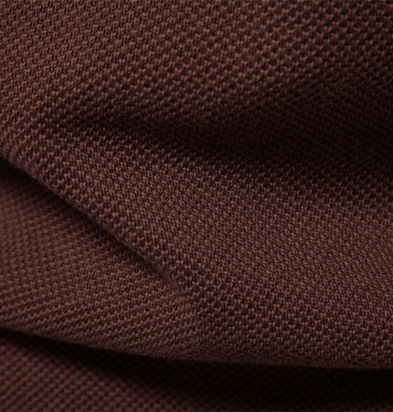 Close-up of soft brown fabric used in the Stand Collar Half-Zip Knit Sweater.