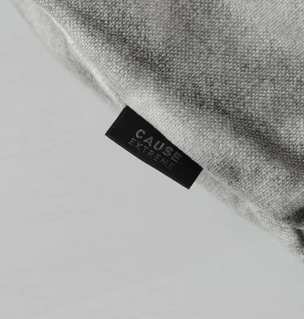 Close-up of the tag on the Spray Paint Spliced Jacket – Casual Fit showing the brand name 'CAUSE EXTREME'