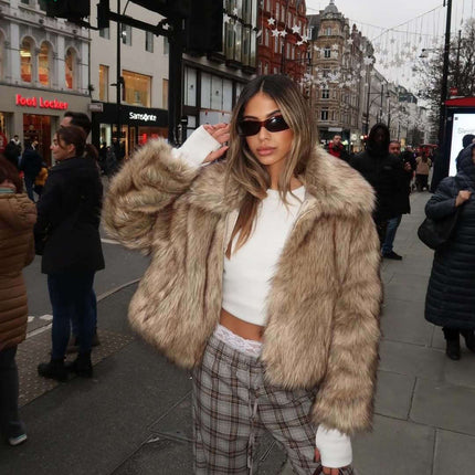 Camel Shearling Zipper Jacket – Regular Fit worn by stylish woman in urban setting, showcasing trendy winter fashion.