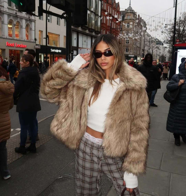 Camel Shearling Zipper Jacket – Regular Fit worn by stylish woman in urban setting, showcasing trendy winter fashion.