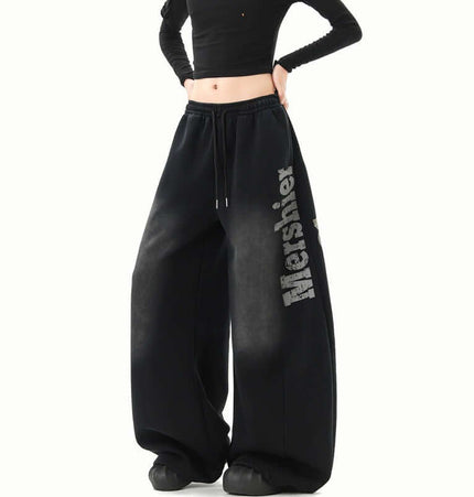 Washed Letter Sweatpants - Loose Fit displayed on model with a cropped top, showcasing their wide-leg style and comfort.
