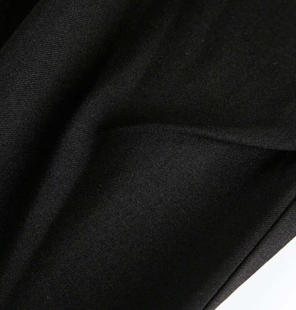 Close-up of fabric texture used in Wide Leg Pleated Plaid Trousers, showcasing the smooth and breathable material.