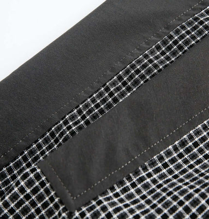 Checkered Patchwork Shirt - Loose Fit with detailed pocket and checkered fabric texture.