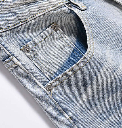Washed Micro Flared Jeans – Loose Fit close-up showing the vintage washed blue denim pocket details.