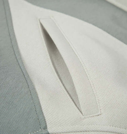 Close-up of the pocket detail on the Color-Block Hooded Jacket – Loose Fit in stylish color-block design.