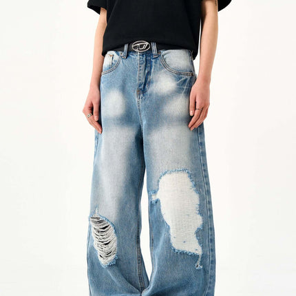 Casual Ripped Light Blue Jeans – Loose Fit worn by a model, showcasing vintage washed finish and ripped details.
