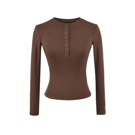 Top de manga larga con media botonera elástica