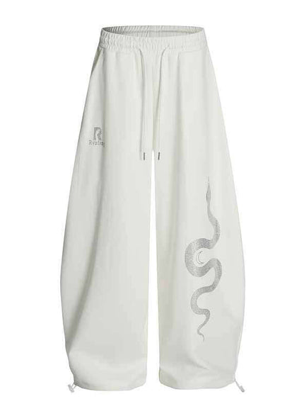 Close-up of White rhinestone snake print pants fabric