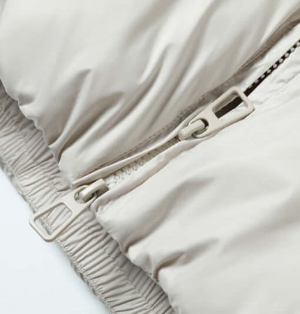 Wave Design Puffer Coat – Loose Fit close-up of zipper detail in beige fabric