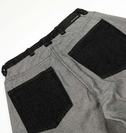 Printed Deconstructed Asymmetrical Jeans back view showcasing unique pocket design and fabric texture.