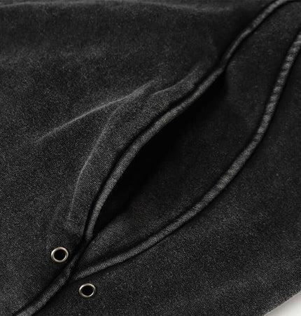 Detail view of the pockets and fabric of the American Retro Washed Hoodie – Loose Fit in black.