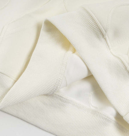 Embroidered Letter Hoodie – Loose Fit close-up of soft cotton fabric and hem detail