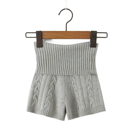 Casual Slim Fit Patterned Wool Shorts hanging on a wooden hanger, featuring a ribbed waistband and knitted design.