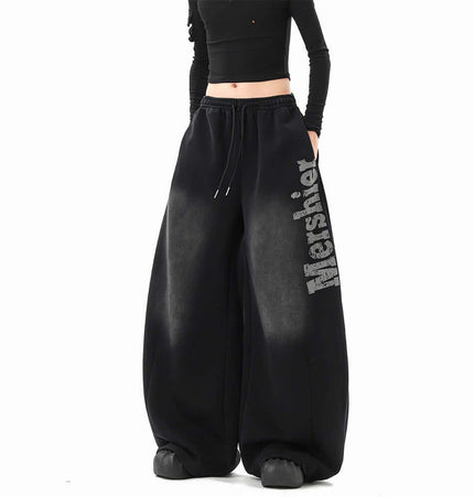 Washed Letter Sweatpants - Loose Fit worn by model, showcasing a stylish hip hop look and comfortable wide-leg design.