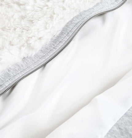 Close-up of the interior lining of the Wool Warm Cotton Coat – Loose Fit with soft textures and zipper detail.