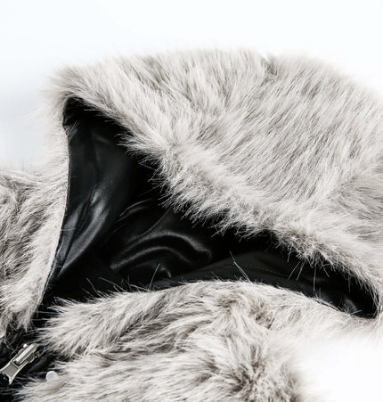 Close-up of the oversized reversible hooded parka showcasing plush faux fur hood detail.