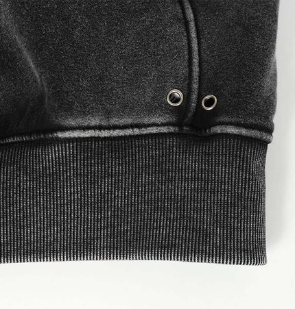 American Retro Washed Hoodie – Loose Fit cuff detail showing ribbed hem and eyelets for style.