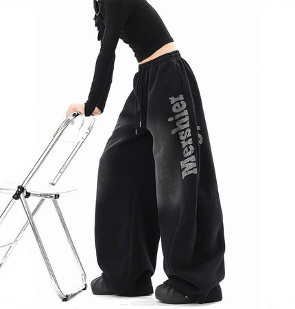 Washed Letter Sweatpants - Loose Fit in black, featuring wide-leg silhouette and comfortable fit for casual streetwear.