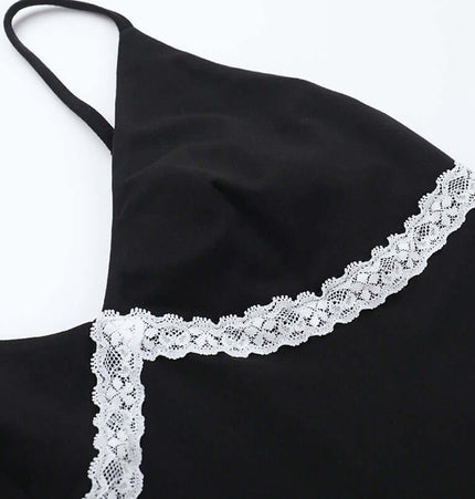 Lace Patchwork VNeck Top – Slim Fit close-up showing delicate lace detail on black fabric.