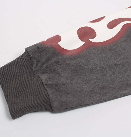 Detail of the Faux Suede Print Zip-Up Hoodie – Loose Fit sleeve showing fabric texture and bold print design.