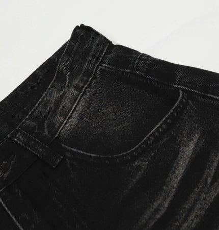 Washed Black Vintage Knife Cut Jeans close-up showing the mid rise waist and fabric texture.