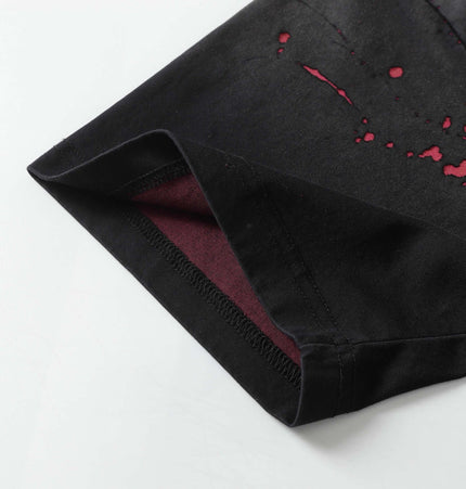 Retro Splatter Print TShirt – Loose Fit close-up view with splatter detail and hem design.