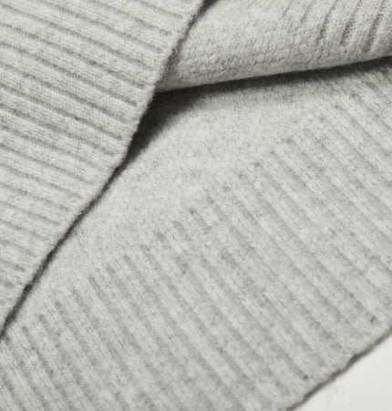 Close-up view of fabric texture of the Semi-High Neck Simple Knit Sweater in light gray color.