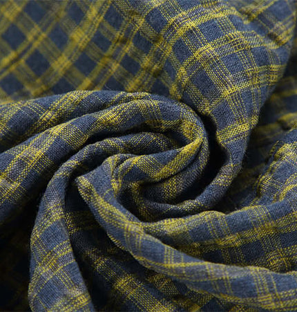 Casual Plaid Shirt – Relaxed Fit fabric close-up with blue and yellow plaid pattern.