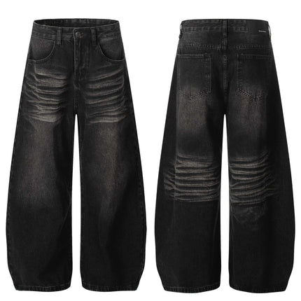 Washed Black Vintage Knife Cut Jeans featuring cat whisker detail and loose fit silhouette.