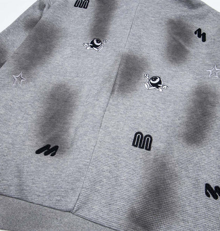 Distressed Letter Zip Hoodie - Loose Fit featuring playful embroidered designs on a gray fabric.