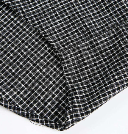 Checkered Patchwork Shirt - Loose Fit close-up of fabric featuring black and white checkered pattern.