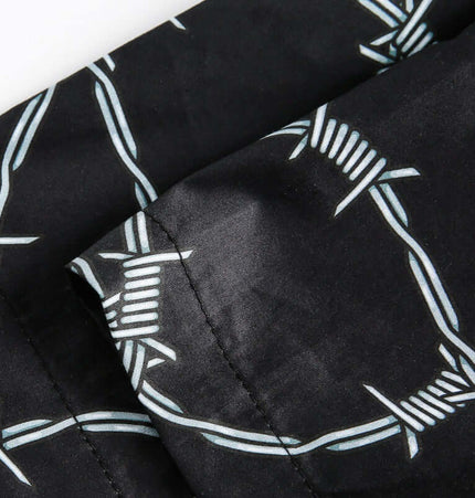 Striped Short Sleeve Shirt - Loose Fit close-up showing bold stripe patterns and soft polyester fabric.