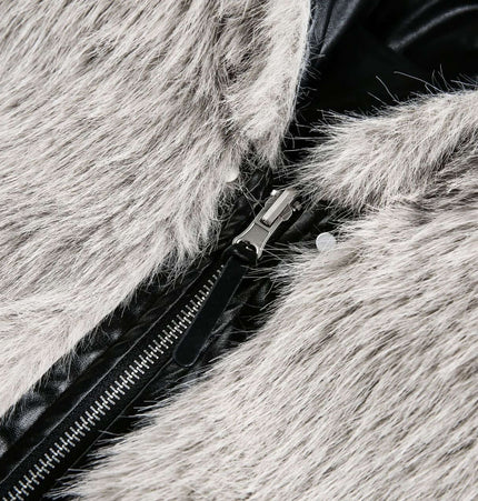 Detail of the fabric and zipper on the Oversized Reversible Hooded Parka featuring faux fur and leather accents.