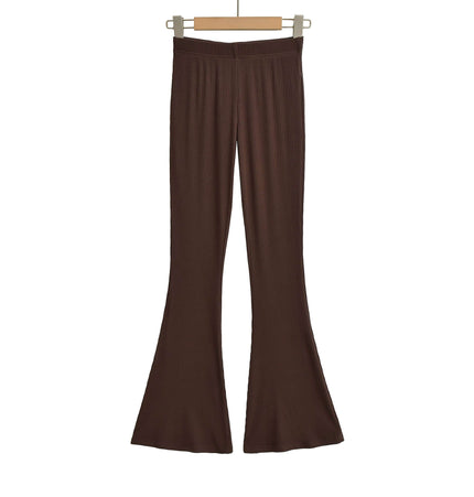 Slim Fit Low Waist Slightly Flared Pants displayed in a brown color on a wooden hanger.