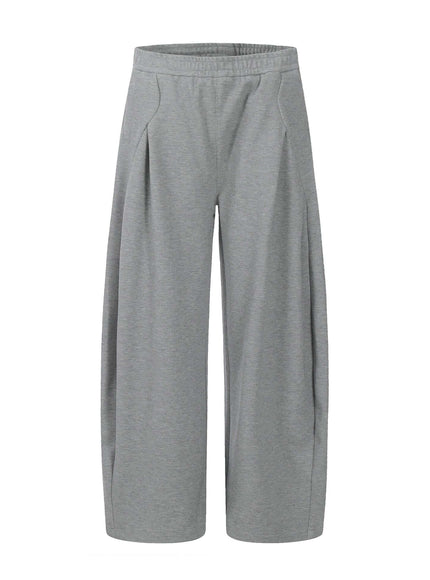 Model wearing Black straight leg tapered sweatpants by Grozavu