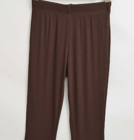 Slim Fit Low Waist Slightly Flared Pants on hanger showcasing ribbed texture and flattering fit in brown color.